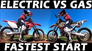Electric dirt bike and gas dirt bike parked side by side for performance comparison